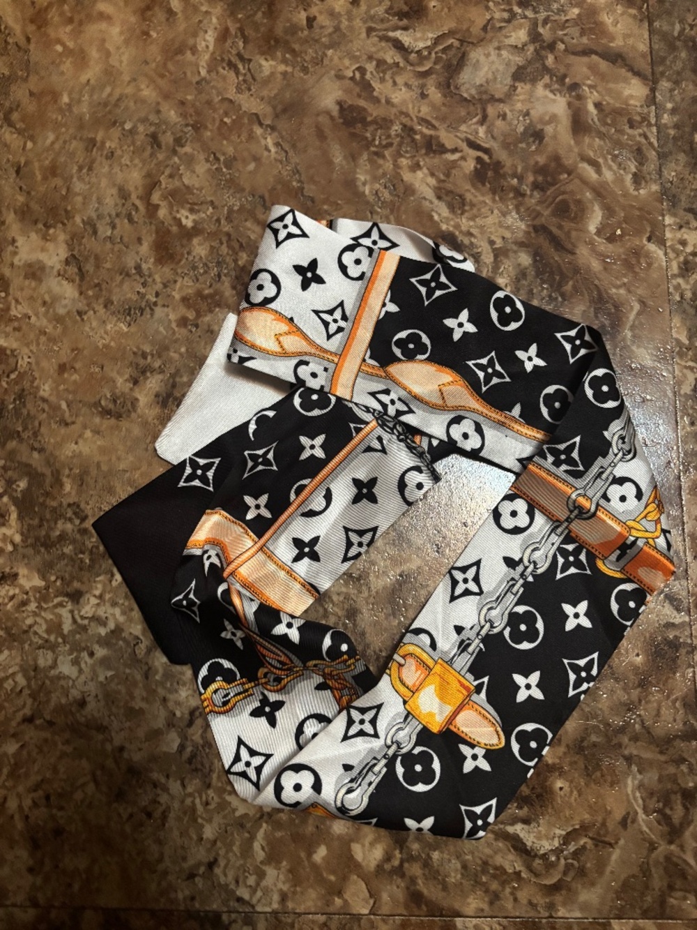 LV scarf. Head, neck, pocketbook